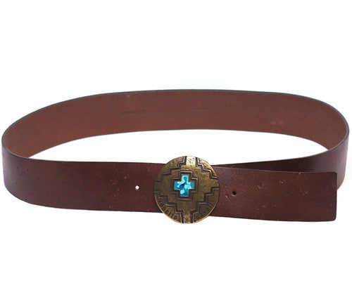 A brown leather belt with a copper buckle featuring a blue crystal in the center. Roberto Cavalli brown/chocolate/tan leather belt / waist strap; round copper/brass concho buckle with engraved Western motif and turquoise-blue stone inlay; smooth one-piece strap; unisex; great with jeans, tailoring or dresses; style tags: western, boho, rock, statement; Italian luxury house from Florence, artisanal craft; vintage, rare piece.